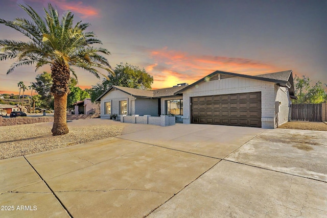 ranch-style house featuring a garage