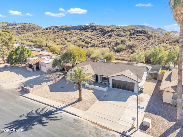 birds eye view of property with a mountain view