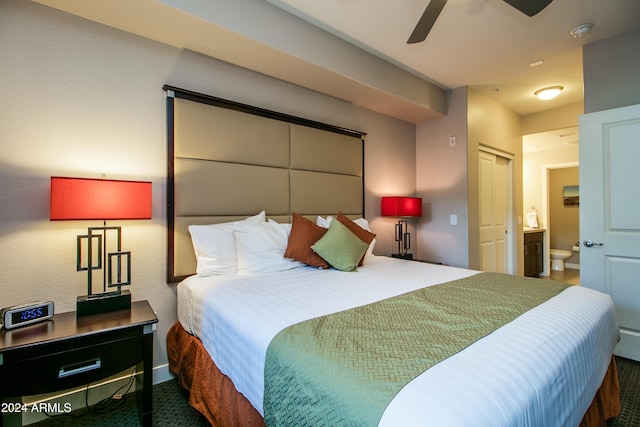 bedroom featuring a ceiling fan and ensuite bath