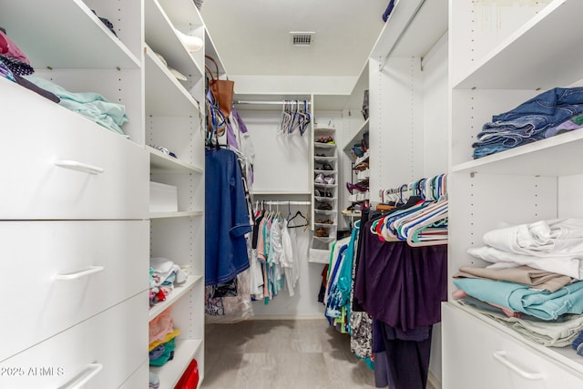 walk in closet featuring visible vents