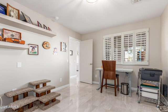 office space featuring visible vents and baseboards