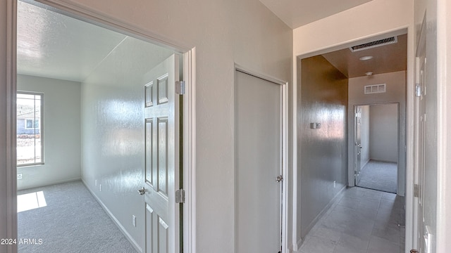 hallway featuring carpet floors