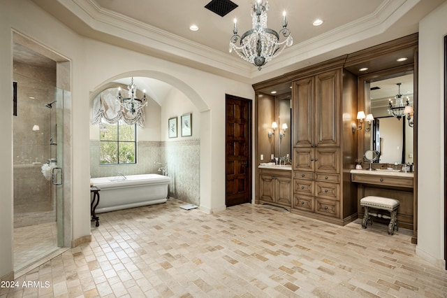 bathroom featuring vanity, separate shower and tub, and ornamental molding