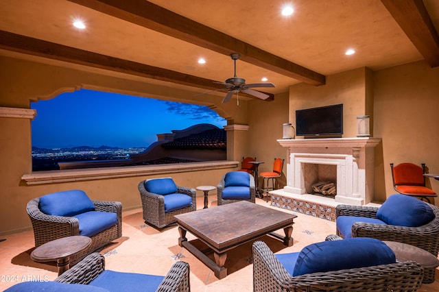 view of patio with an outdoor living space with a fireplace and ceiling fan