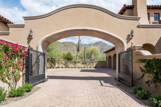 view of gate with a mountain view