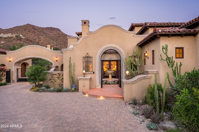 mediterranean / spanish home featuring a mountain view