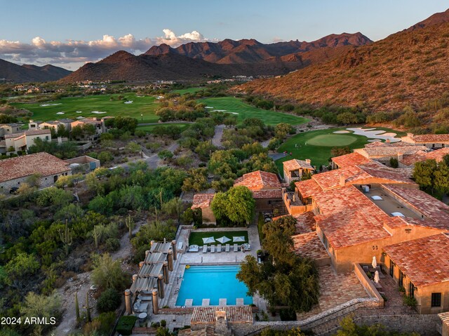 birds eye view of property with a mountain view