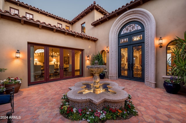 doorway to property with french doors and a patio area