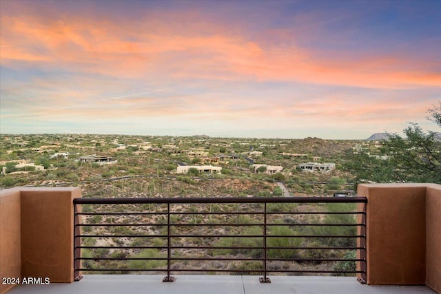 view of balcony at dusk