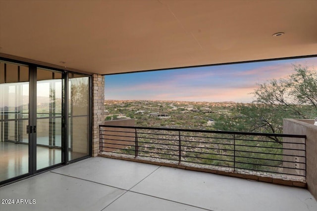 view of balcony at dusk