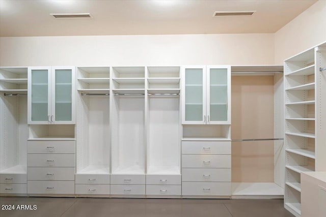 spacious closet featuring tile patterned flooring