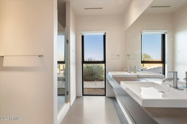 bathroom featuring concrete flooring and vanity