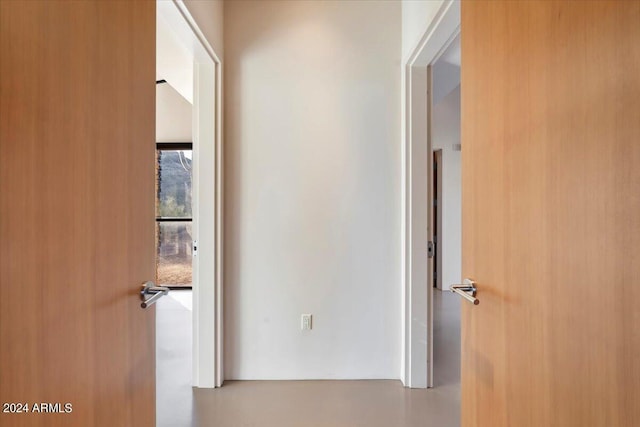 hallway featuring concrete floors