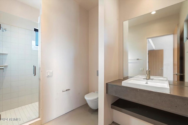 bathroom featuring vanity, toilet, and an enclosed shower