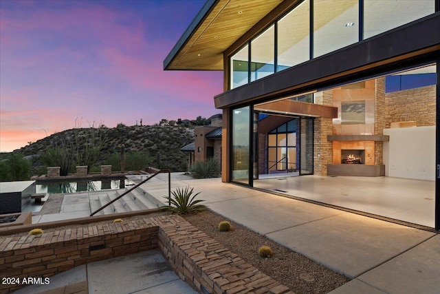 view of patio terrace at dusk