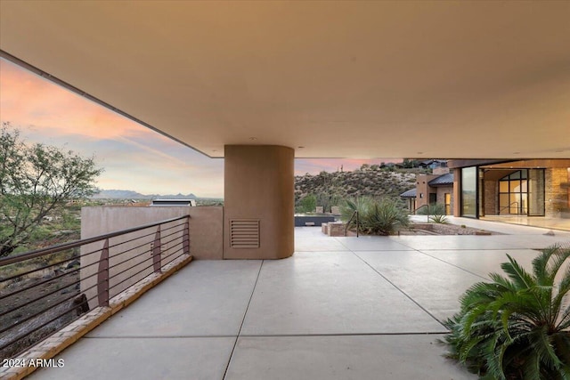 view of patio terrace at dusk