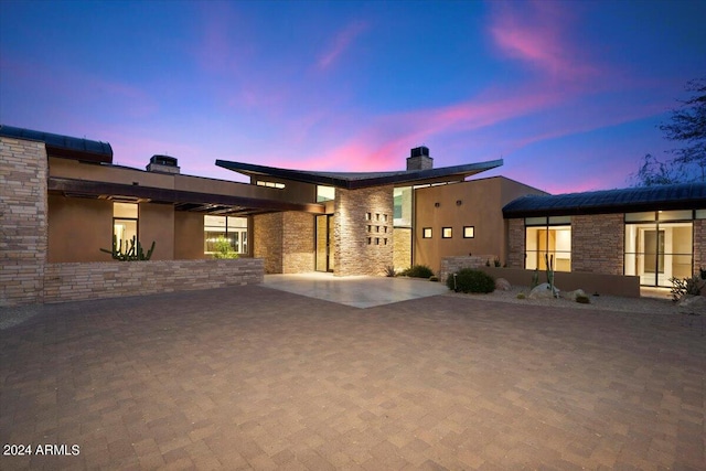 view of front of home featuring a patio