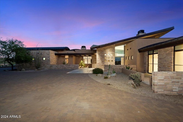 modern home featuring a patio area