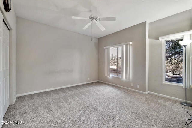 empty room with light carpet and ceiling fan