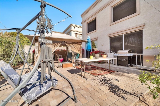 view of patio / terrace with a gazebo and area for grilling