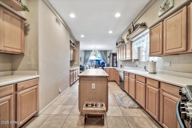 kitchen featuring a center island, decorative light fixtures, stainless steel appliances, sink, and light tile patterned floors