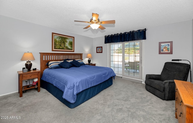 carpeted bedroom with a textured ceiling and ceiling fan