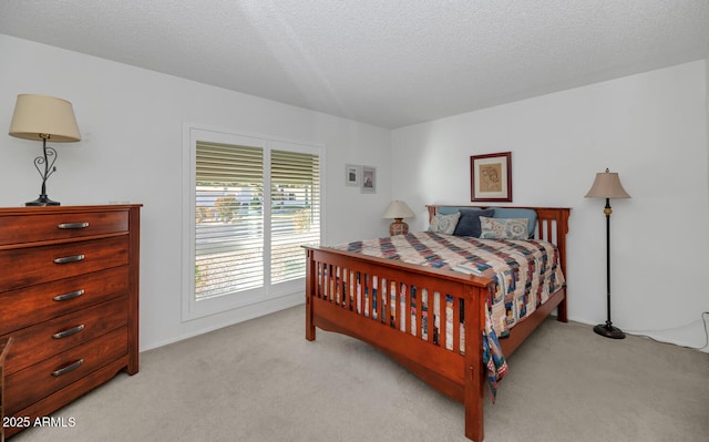 carpeted bedroom featuring a textured ceiling