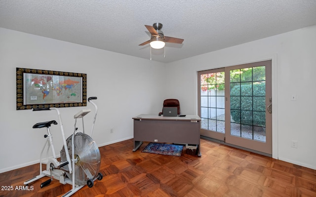 office area with ceiling fan, a textured ceiling, and parquet flooring