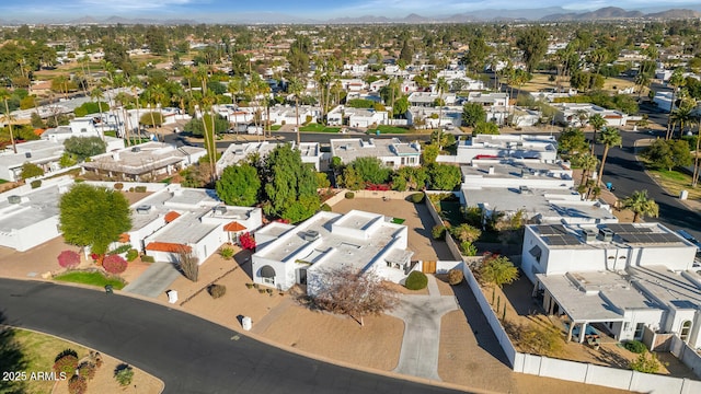 birds eye view of property with a mountain view