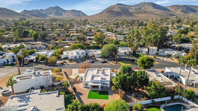 birds eye view of property with a mountain view