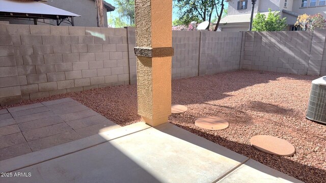 view of patio / terrace featuring central AC and a fenced backyard