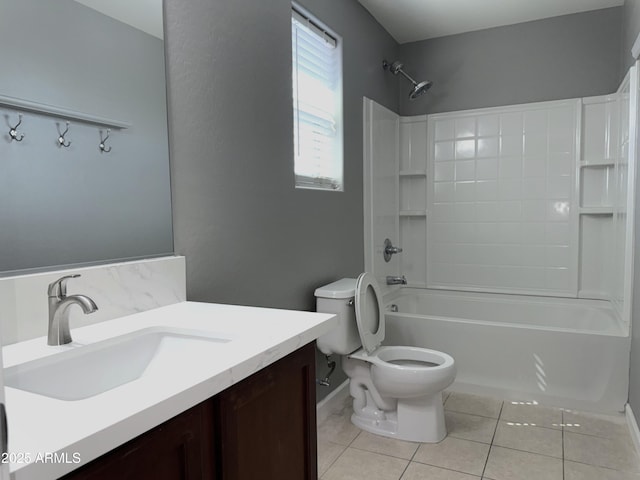 full bathroom featuring vanity, shower / bathing tub combination, tile patterned floors, toilet, and baseboards