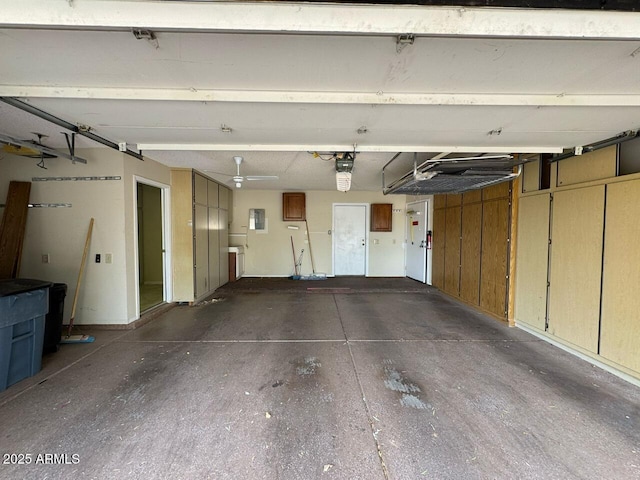 garage featuring a garage door opener and electric panel