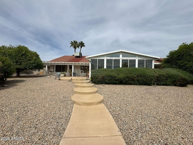 view of front facade featuring a sunroom