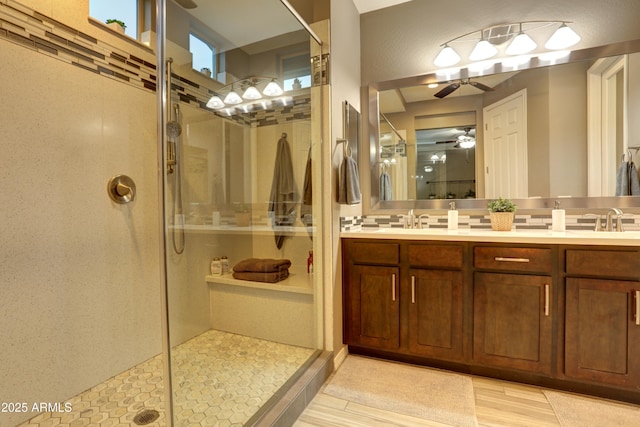 bathroom featuring an enclosed shower and vanity