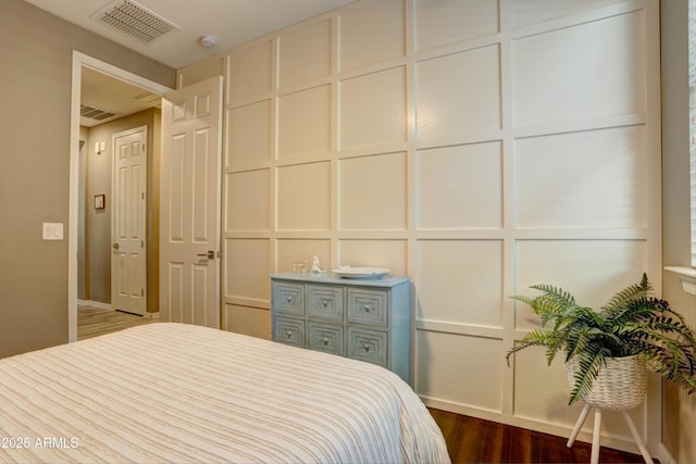 bedroom featuring dark wood-type flooring