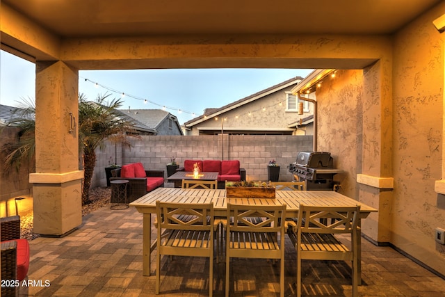 view of patio / terrace with a fire pit and grilling area