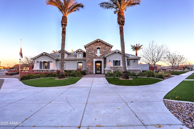 view of front of property with a lawn