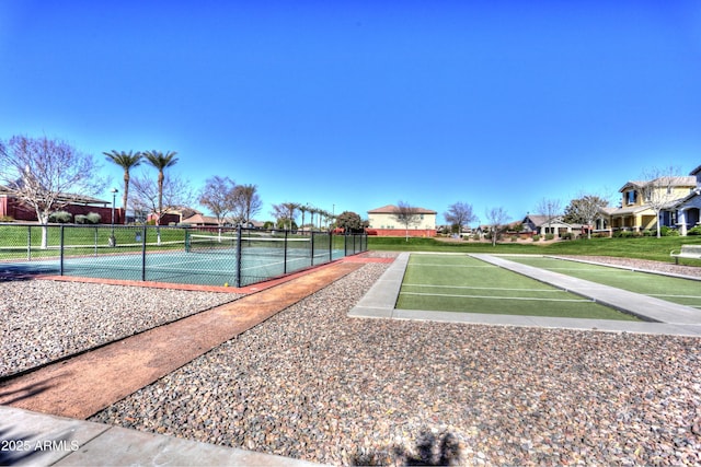 surrounding community featuring tennis court