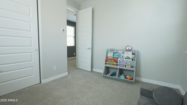 game room with carpet flooring and baseboards