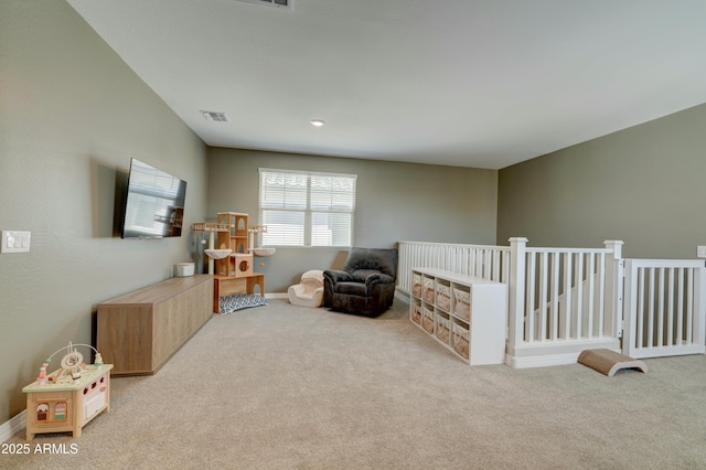 interior space with visible vents, baseboards, and carpet floors