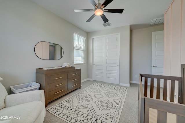 bedroom featuring light carpet, visible vents, and baseboards