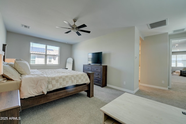 bedroom with visible vents and light colored carpet