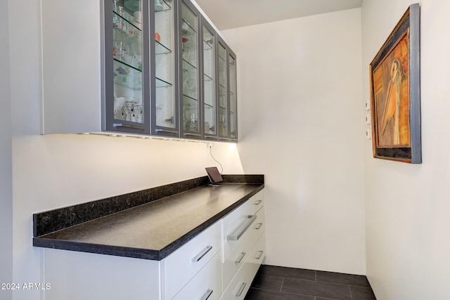 bar featuring white cabinetry