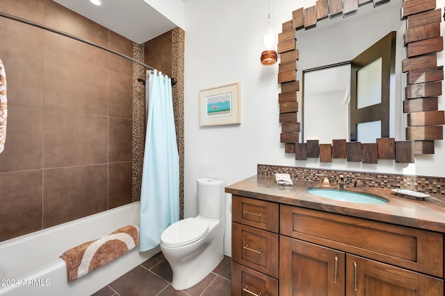 full bathroom with shower / tub combo with curtain, vanity, tasteful backsplash, tile patterned floors, and toilet