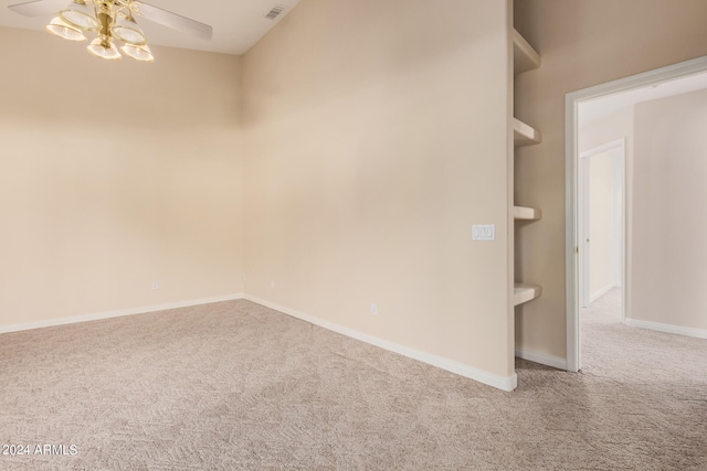 carpeted empty room with ceiling fan