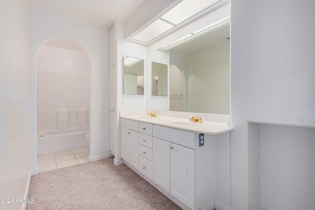 bathroom featuring vanity, toilet, and tile patterned floors