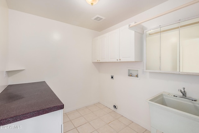 washroom featuring hookup for an electric dryer, washer hookup, cabinets, and sink