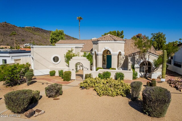 mediterranean / spanish home featuring a mountain view