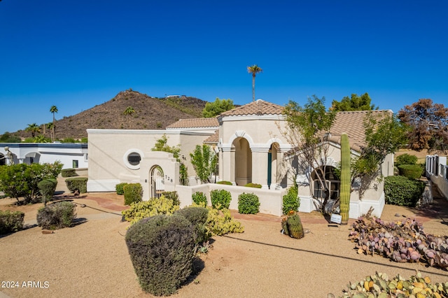 mediterranean / spanish-style home with a mountain view